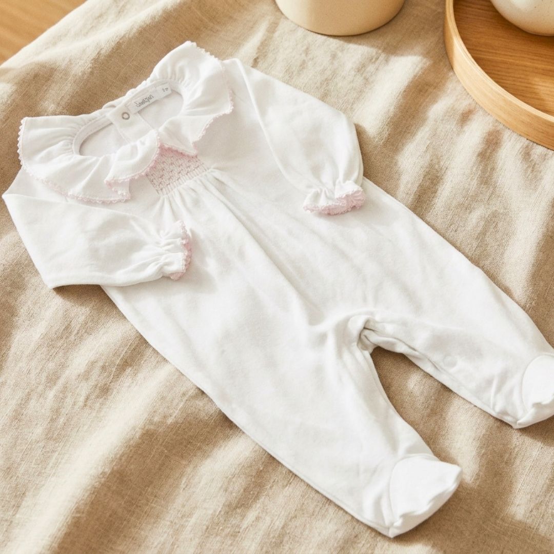 Pijamita con nido de abeja rosa